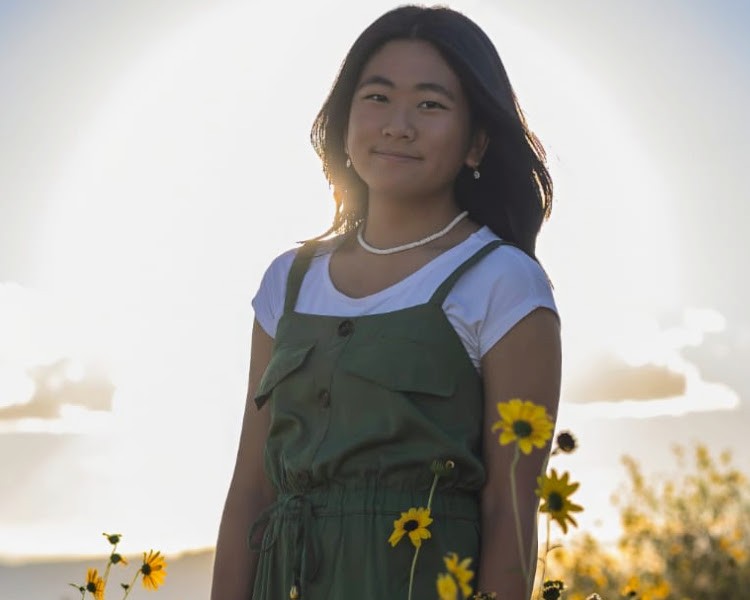 Girl in a field of sunflowers